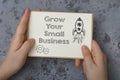 a piece of paper with the words grow your small business Royalty Free Stock Photo