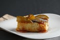 Piece of pear pie with poppy and sauce