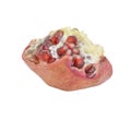A piece of pomegranate with peel and seeds on a white background