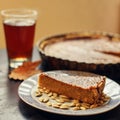 Piece of pumkin pie with seeds and tea. Thanksgiving Royalty Free Stock Photo