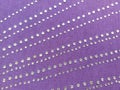 Piece of purple cloth with rhinestones