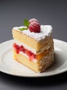 Piece of raspberry cake on a plate.