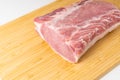 Piece of raw boneless pork loin on cutting board Royalty Free Stock Photo