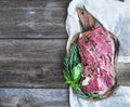 A piece of raw fresh beef (Ribeye steak) marinated in spices and Royalty Free Stock Photo
