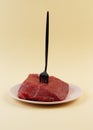 A piece of raw meat lies on a plate. Veal tenderloin. Predatory diet label. Zero carbohydrate diet concept. Ketogenic Royalty Free Stock Photo