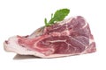 Piece of raw meat on a white with freshherbs Royalty Free Stock Photo