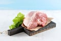 Piece of raw pork ham on wooden Board Royalty Free Stock Photo