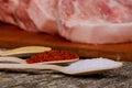 Piece of raw pork loin on old cutting board, Stewed pork raw and spices Royalty Free Stock Photo