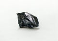 A piece of raw Stibnite mineral rock on white background. antimonite is a sulfide mineral