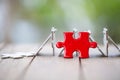 Piece of Red   jigsaw puzzle On the old wood. teamwork concept.  symbol of association and connection. business strategy Royalty Free Stock Photo