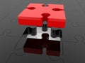 A piece of red puzzle above a black puzzle Royalty Free Stock Photo