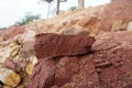 A piece of red shale sedimentary rock on nature background. Royalty Free Stock Photo