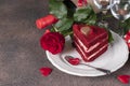 Piece of Red Velvet cake, bottle of wine, rose and gift for Valentines Day or birthday Royalty Free Stock Photo