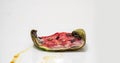 Piece of ripe watermelon rots on white background, time lapse, educational cognitive video