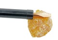 Piece of rosin and electric soldering iron