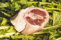 Piece of salted pork shoulder on fresh turnip greens