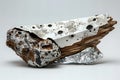 A piece of scrap metal with white and brown patterns on it, an object made from wood that has been cut off at the bottom and is c Royalty Free Stock Photo