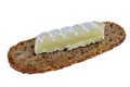 French sheep cheese on a slice of bread isolated