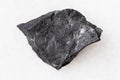 piece of shungite shale stone on white Royalty Free Stock Photo