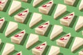 Piece slice cheesecake pattern on green background