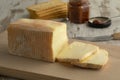 Piece and slices of traditional Italian Taleggio dop Royalty Free Stock Photo