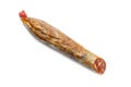 Piece of Spanish chorizo sausage Chorizo iberico on white background. Royalty Free Stock Photo