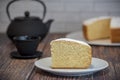 A piece of sponge cake is served with a cup of tea Royalty Free Stock Photo
