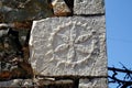 Piece of stone with sculptured symbol