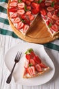 Piece of strawberry tart close-up vertical top view Royalty Free Stock Photo