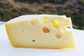 Piece of swiss cheese with holes Royalty Free Stock Photo