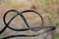 A piece of tangled black electrical wire