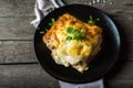 Piece of tasty hot lasagna with red wine. Small depth of field. Traditional italian lasagna. Portion. Italian food. Food on black Royalty Free Stock Photo