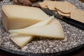 Piece of tasty Ossau-Iraty or Esquirrou sheep cheese produced in south-western France, Northern Basque Country