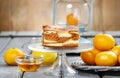 Piece of toffee and vanilla cake on transparent glass cake stand Royalty Free Stock Photo