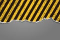 Piece of torn lined, yellow and black, stained grunge paper with soft shadow stuck on darg grey background. Vector Royalty Free Stock Photo