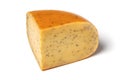 Piece of traditional mature Dutch cumin cheese on white background
