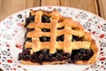 Piece of triangular homemade lattice pie with whole wild blueberries Royalty Free Stock Photo