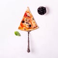 Piece of vegetarian pizza with mushrooms and olives on white background. Royalty Free Stock Photo