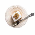 Piece walnut carrot cake and fork Isolated on white background. Royalty Free Stock Photo