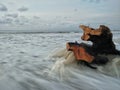 a piece of wood on the beach swept away by the waves