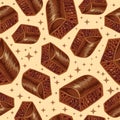 Pieces of aerated chocolate on a beidge background