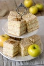 Pieces of apple cake and dried apples on a wooden table. Rustic style. Royalty Free Stock Photo