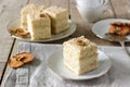 Pieces of apple cake and dried apples on a wooden table. Rustic style. Royalty Free Stock Photo