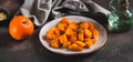 Pieces of baked pumpkin with rosemary on a plate on the table web banner Royalty Free Stock Photo