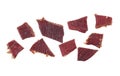 Pieces of beef jerky isolated on white background, top view. Cured meat. Dried meat Royalty Free Stock Photo
