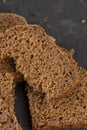 pieces of black rye bread from mixed wheat flour with rye flour