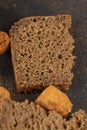 pieces of black rye bread from mixed wheat flour with rye flour