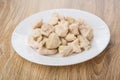 Pieces of boiled chicken meat in plate on table Royalty Free Stock Photo