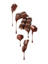 Pieces of broken chocolate bar with dripping drops isolated on a white background Royalty Free Stock Photo