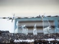 Pieces of broken glass cemented on top of barbed wire fence for protection of any intruder climbing Royalty Free Stock Photo